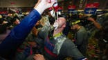 Will Smith celebrates in the clubhouse after Game 5 of the World Series.