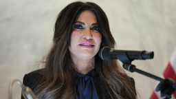 U.S. Ambassador to Greece Kimberly Guilfoyle speaks at an event. Her attorney has disputed allegations involving her financial dealings and conduct.