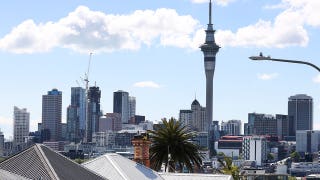 Tourist dangles 23 stories above busy street in 'reckless' daredevil stunt