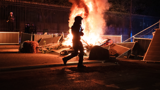 Photos show aftermath of riots as masked groups clash with police across France