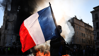 Photos show aftermath of riots as masked groups clash with police across France