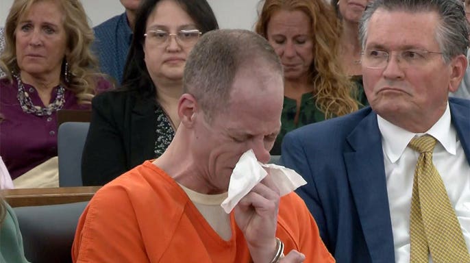 Caleb Flynn cries as a letter from one of his daughters is read in court before his sentencing in the death of his wife, Ashley Flynn, on Oct. 5, 2026.