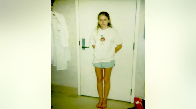 Kara Robinson Chamberlain looking somber after her medical exam.