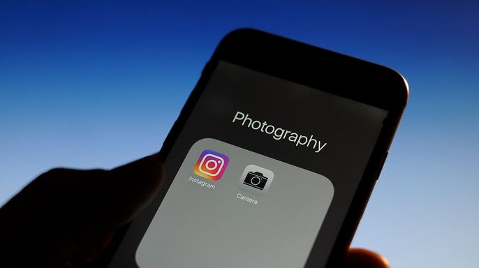 An iPhone open to its photography apps.