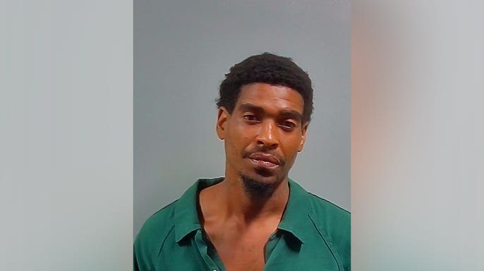 Van Gary Spikes Jr. is pictured following his arrest in Escambia County, Florida.