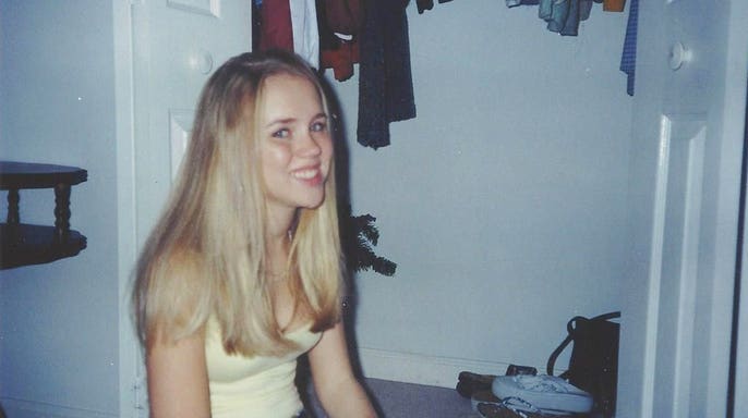 Kara Robinson Chamberlain smiling as a young girl.