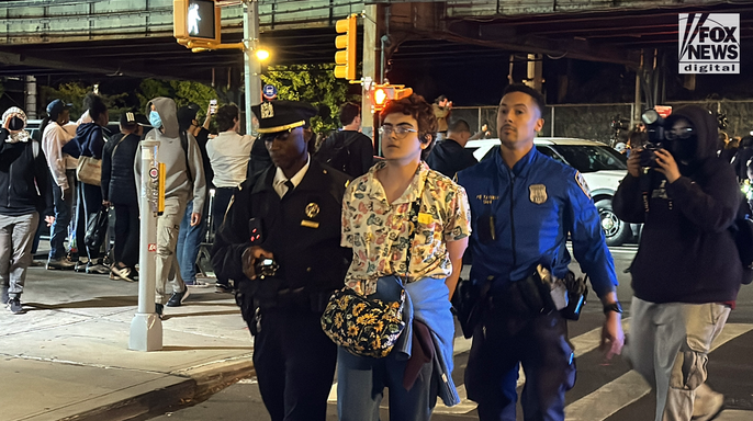 A protester is taken into custody as demonstrations erupt in the Bronx following an ICE-involved shooting in New York City on Thursday, Oct. 8, 2026.