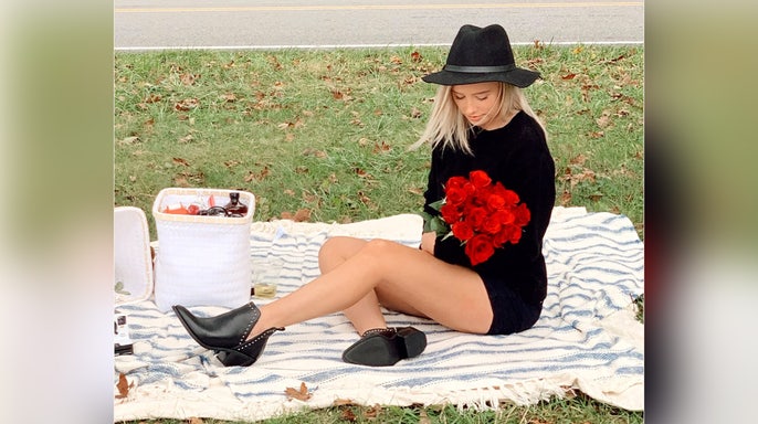 image shows photo of victim holding flowers
