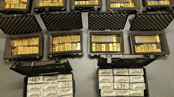 Gold bars and cash in boxes.