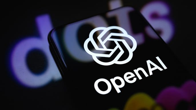 OpenAI logo displayed on a smartphone screen with Dots promotional artwork projected onto a reflective surface.