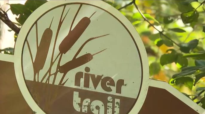 image shows Lansing River Trail sign