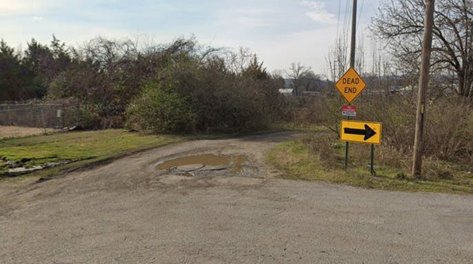 image shows dirt road