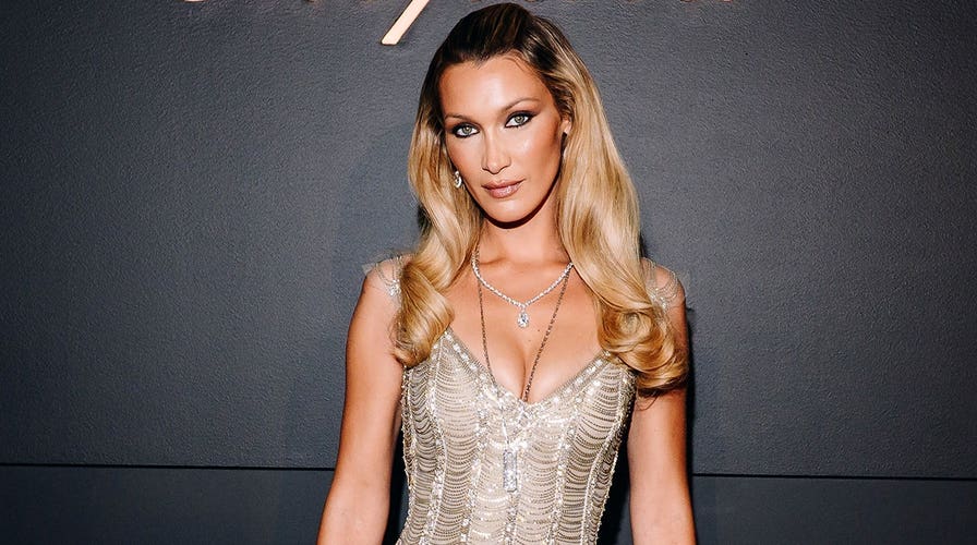 Bella Hadid turns heads in daring red sheer gown at FX’s ‘The Beauty’ New York premiere