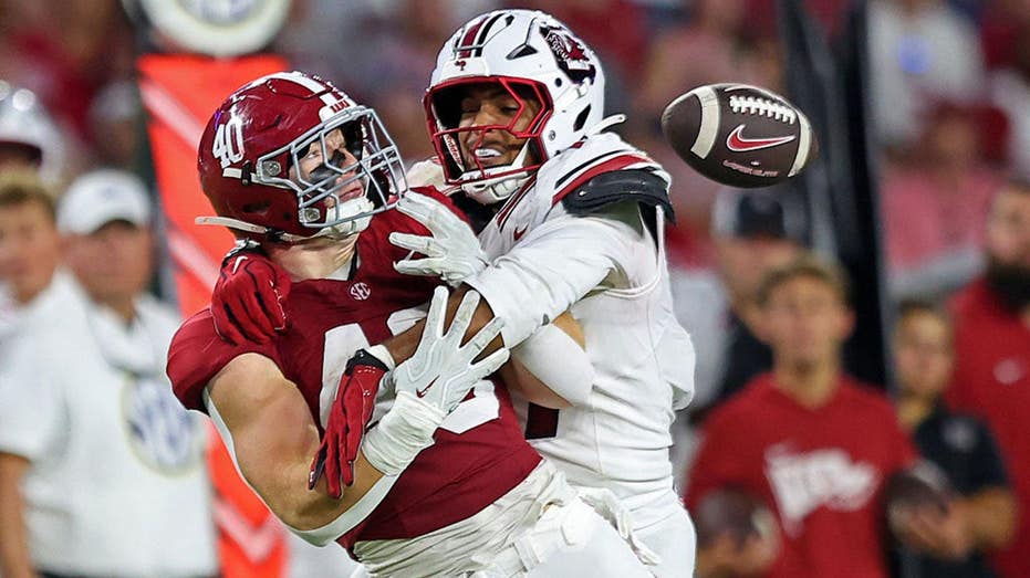 Alabama player ‘determined’ to play after surgery three days ago, while officials plan for Hurricane Isaias
