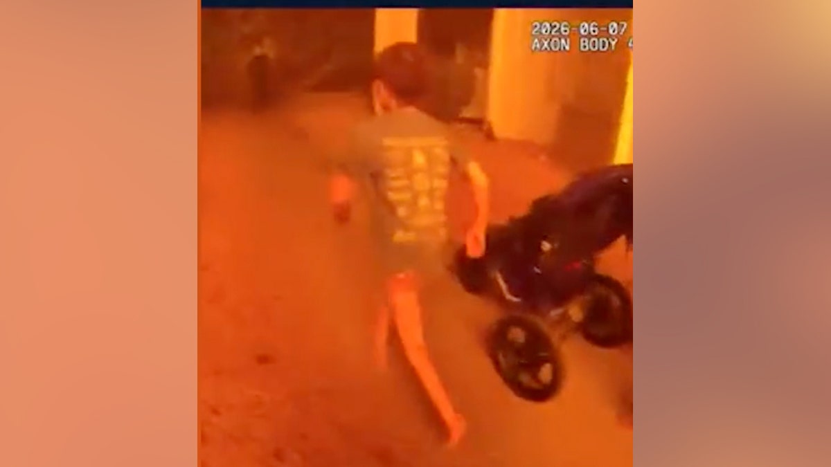 A child runs from an apartment fire blaze in St. George, Utah on June 7, 2026