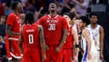 DALLAS, TEXAS - MARCH 31:  DJ Burns Jr. #30 of the North Carolina State Wolfpack reacts after scoring and drawing a foul in the second half of the Elite 8 round of the NCAA Men's Basketball Tournament against the Duke Blue Devils at American Airlines Center on March 31, 2024 in Dallas, Texas. (Photo by Carmen Mandato/Getty Images)