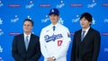 Dec 14, 2023; Los Angeles, CA, USA;  Los Angeles Dodgers player Shohei Ohtani stands with his agent Nez Balelo (left) and interpreter Ippei Mizuhara at an introductory press conference at Dodger Stadium. Mandatory Credit: Kirby Lee-USA TODAY Sports