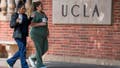 People walk through the campus of the UCLA college in Westwood, California on March 6, 2020. - Three UCLA students are currently being tested for the COVID-19 (coronavirus) by the LA Departement of Public Health, according to the UCLA Chancellor Gene Block. (Photo by Mark RALSTON / AFP) (Photo by MARK RALSTON/AFP via Getty Images)