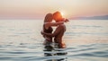 Silhouette of a couple in love in the sea