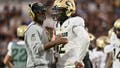 ORLANDO, FLORIDA - SEPTEMBER 28: Head coach Deion Sanders of the Colorado Buffaloes talks with Shedeur Sanders #2 during the second half of a game against the UCF Knights at FBC Mortgage Stadium on September 28, 2024 in Orlando, Florida. (Photo by Julio Aguilar/Getty Images) - Fox News