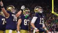 SOUTH BEND, INDIANA - DECEMBER 20: Riley Leonard #13 of the Notre Dame Fighting Irish celebrates with teammates after running the ball for a touchdown during the fourth quarter against the Indiana Hoosiers in the Playoff First Round game at Notre Dame Stadium on December 20, 2024 in South Bend, Indiana. Notre Dame defeated Indiana 27-17. (Photo by Michael Reaves/Getty Images) - Fox News